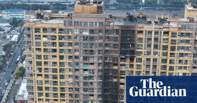 The Guardian-Apartment block fire in Chinas Nanjing city kills at least 15 officials say